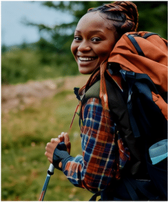 Person camping outdoors in nature