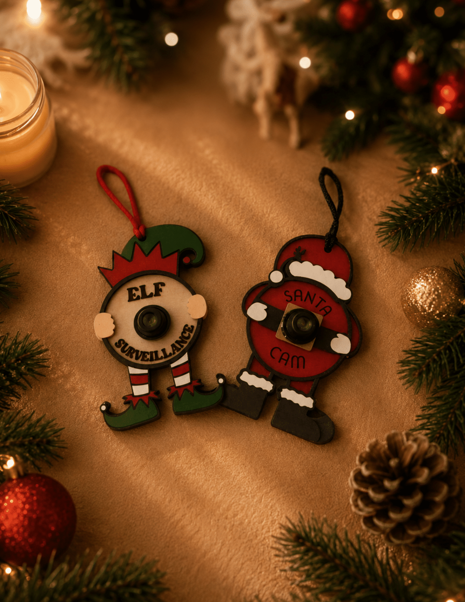Santa Cam and Elf Surveillance ornaments with realistic 3D camera lens Christmas decorations.