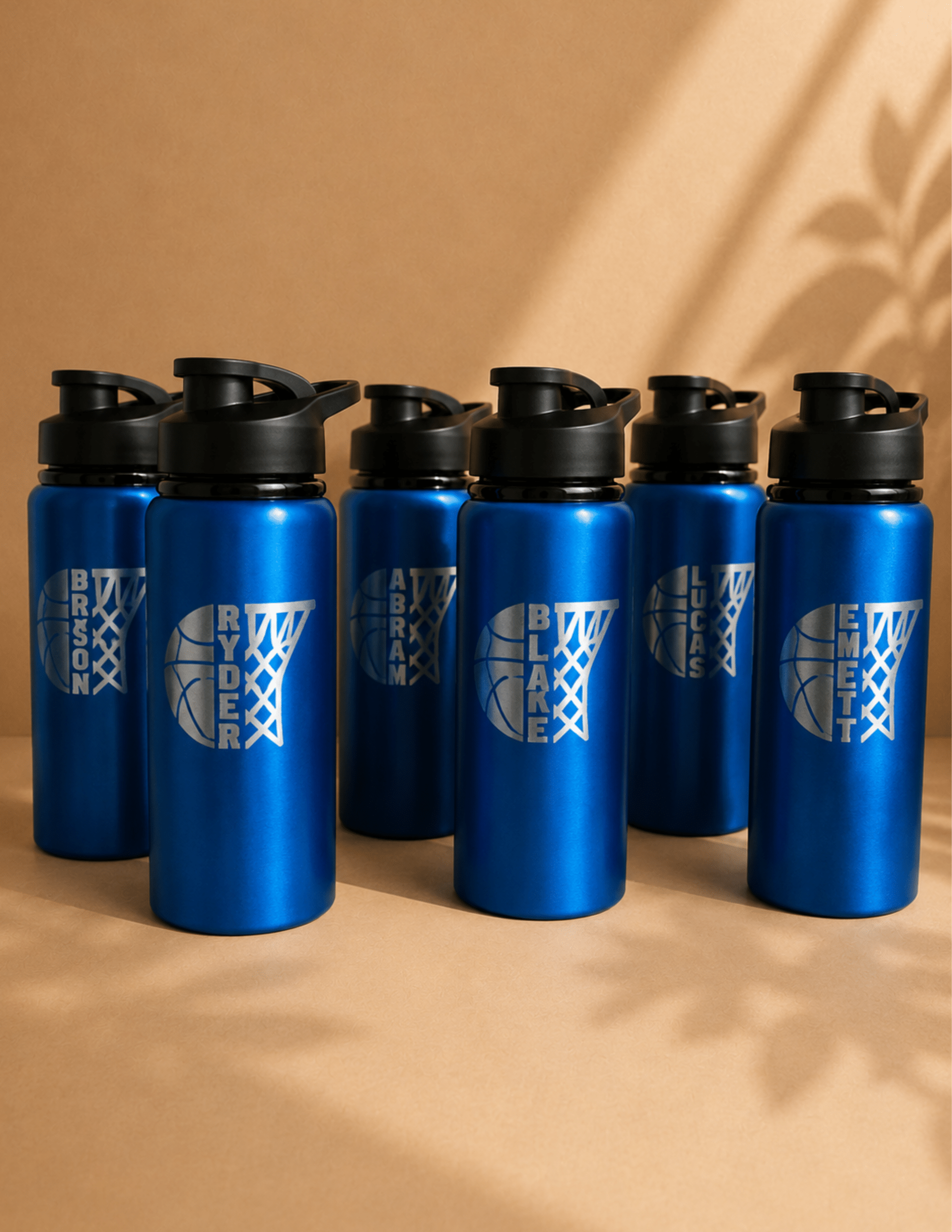 Blue personalized team water bottles with custom player names for basketball teams and other sports.