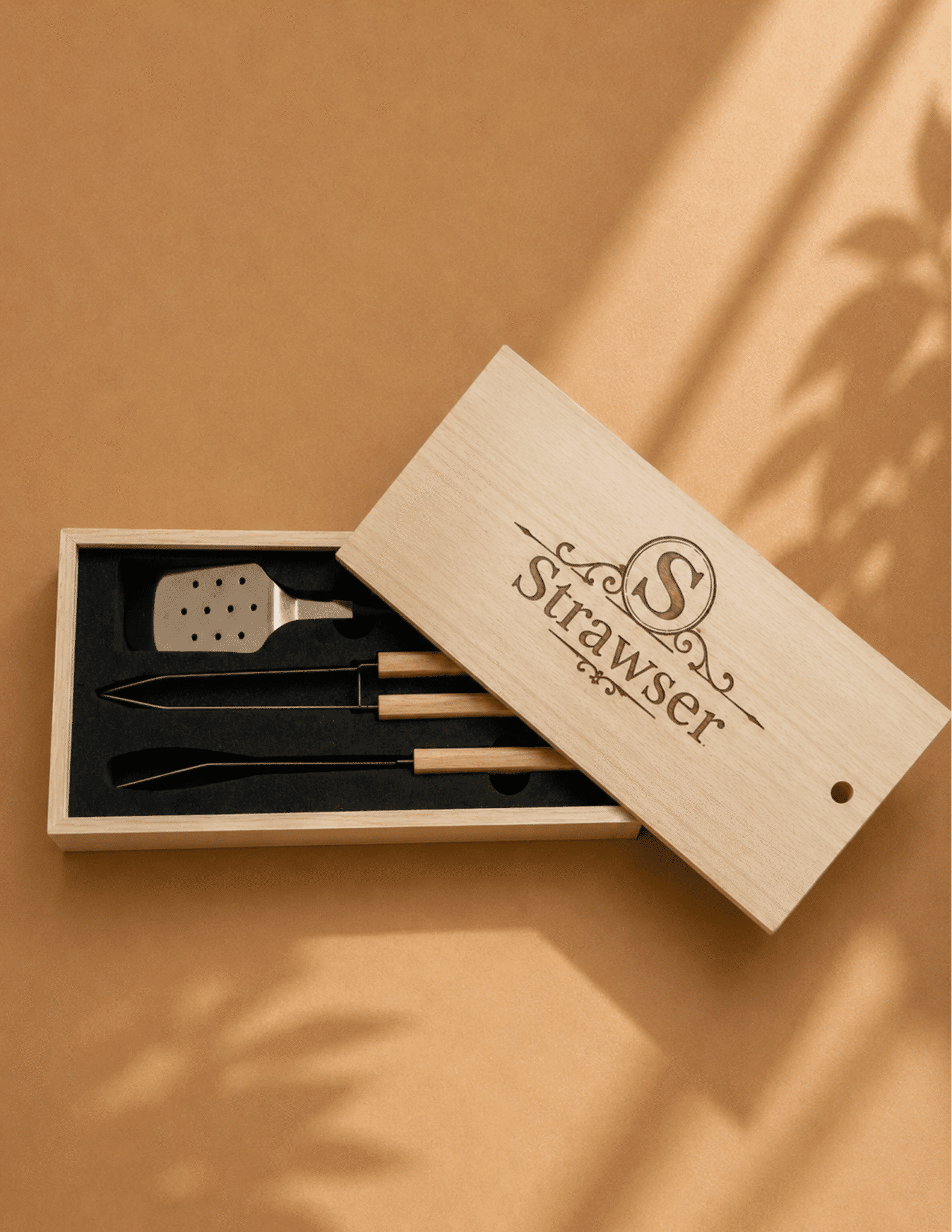 Personalized engraved BBQ grill tool set with stainless steel utensils in a wooden gift box.