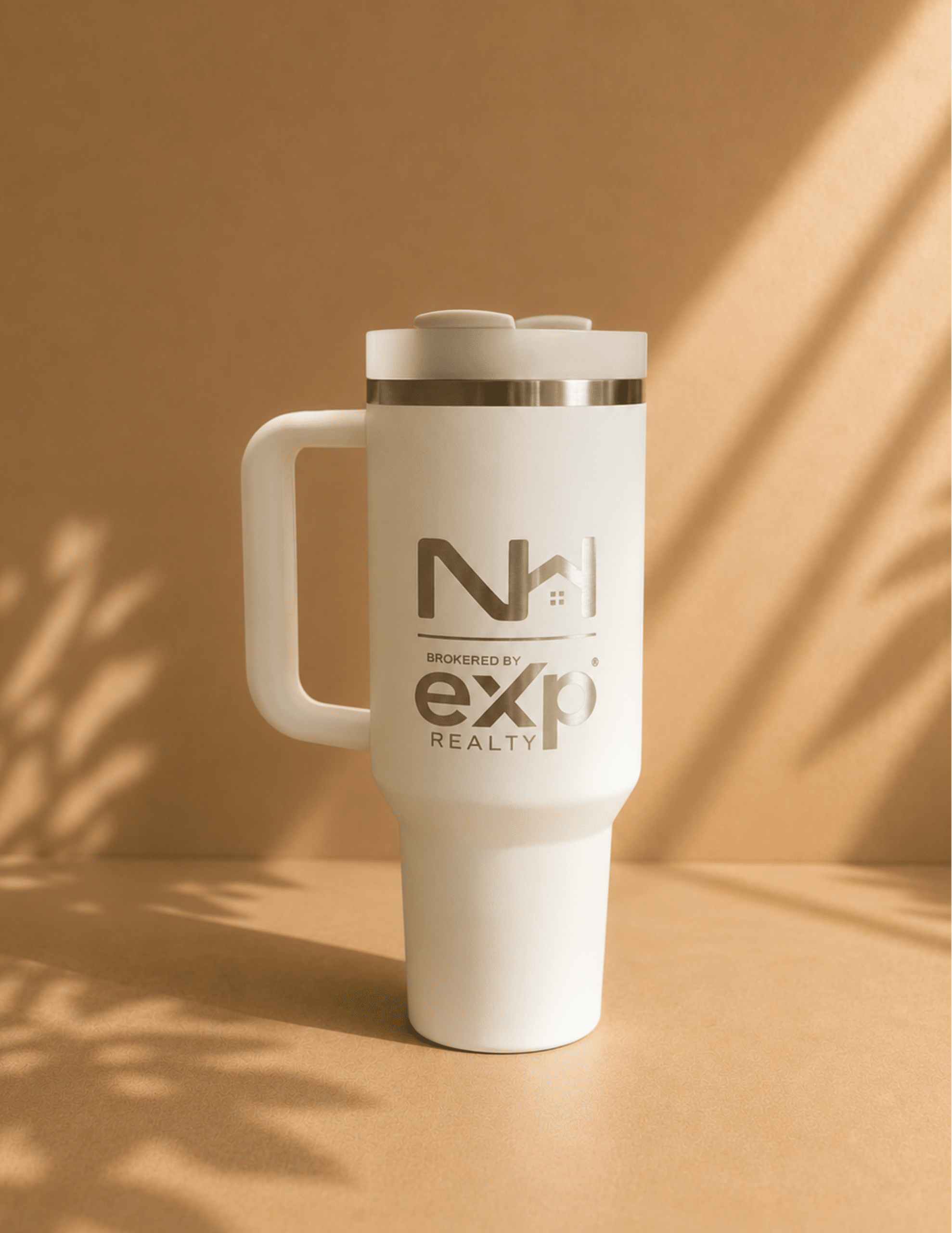 Personalized engraved insulated tumbler with handle and lid for hot or cold drinks.