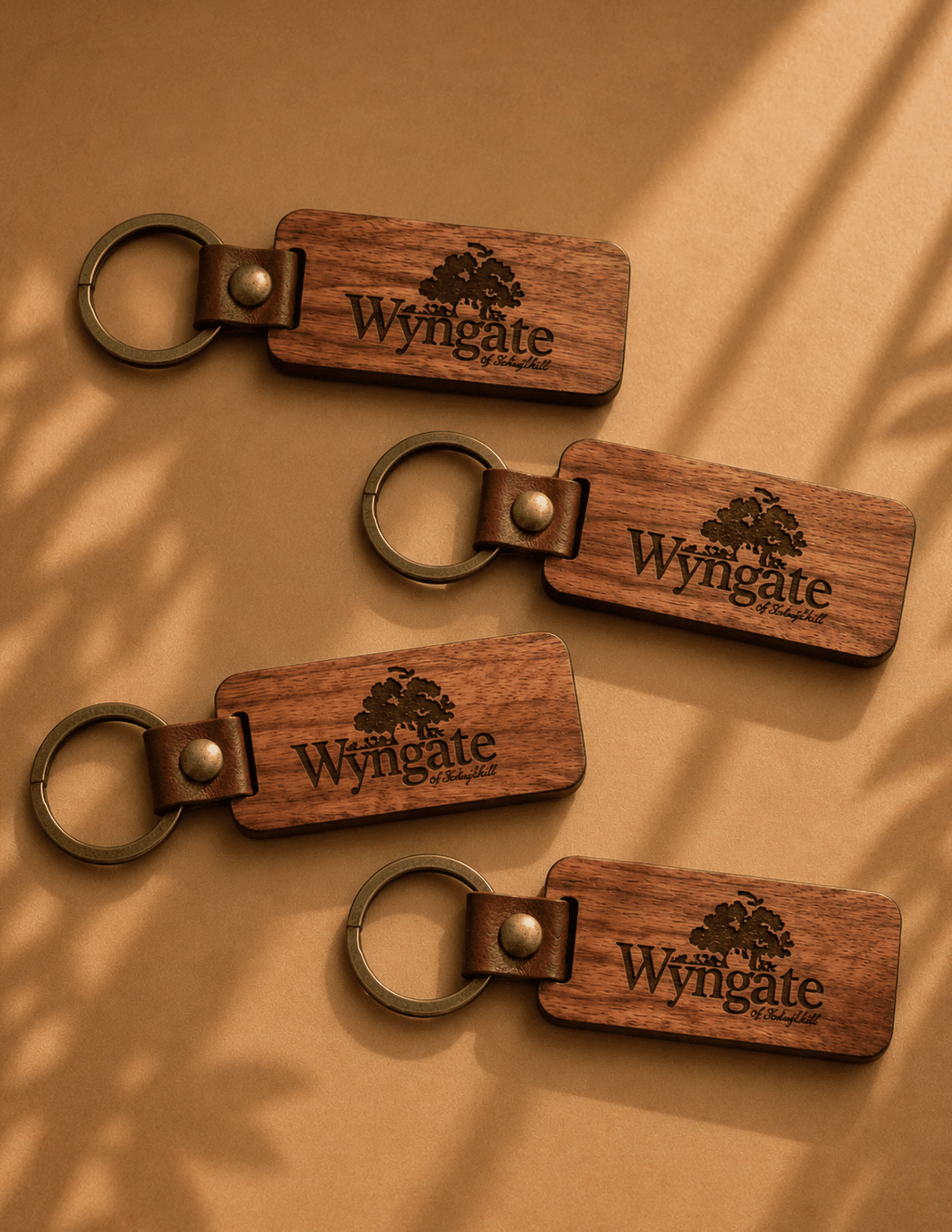 Personalized wooden keychain with custom engraving, leather accent, and metal key ring.
