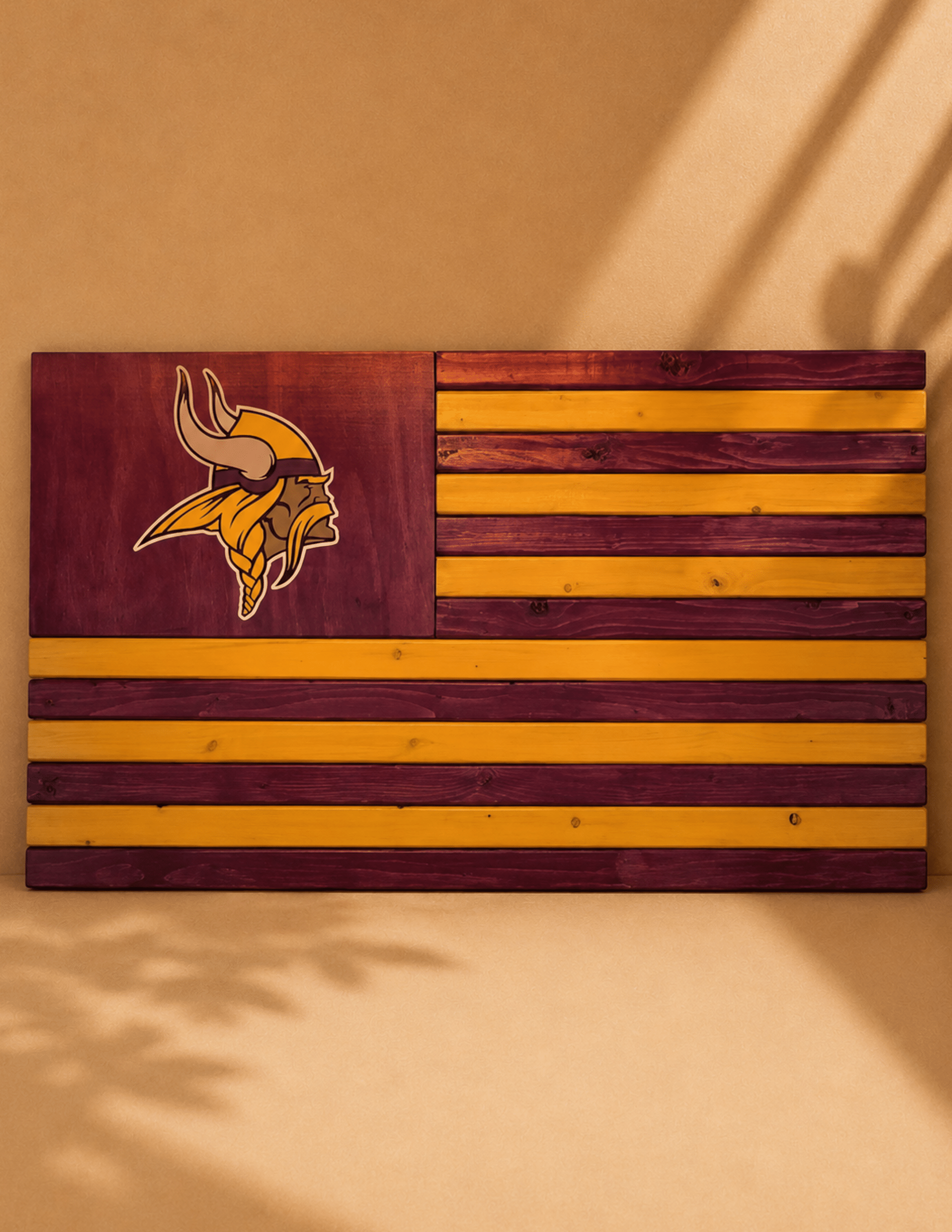 Handcrafted wooden American flag wall décor with bold team-inspired colors for sports fans and home display.