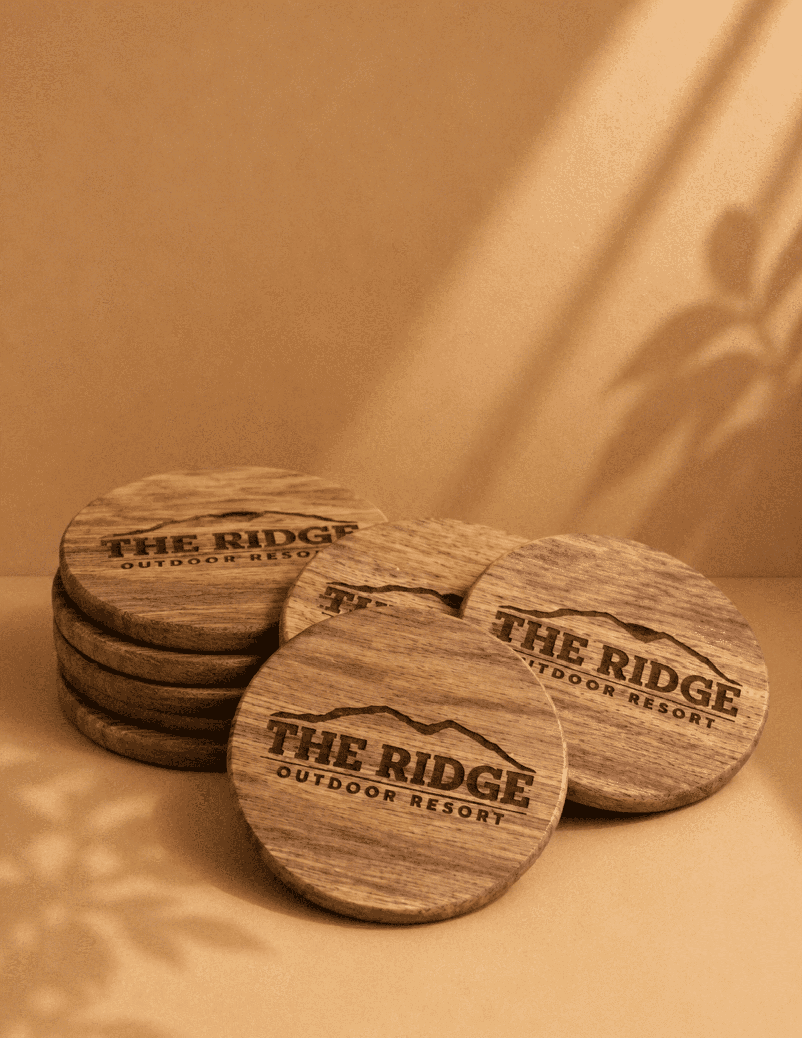 Custom engraved wooden coasters with business logo for branding, promotional events, and corporate gifts.