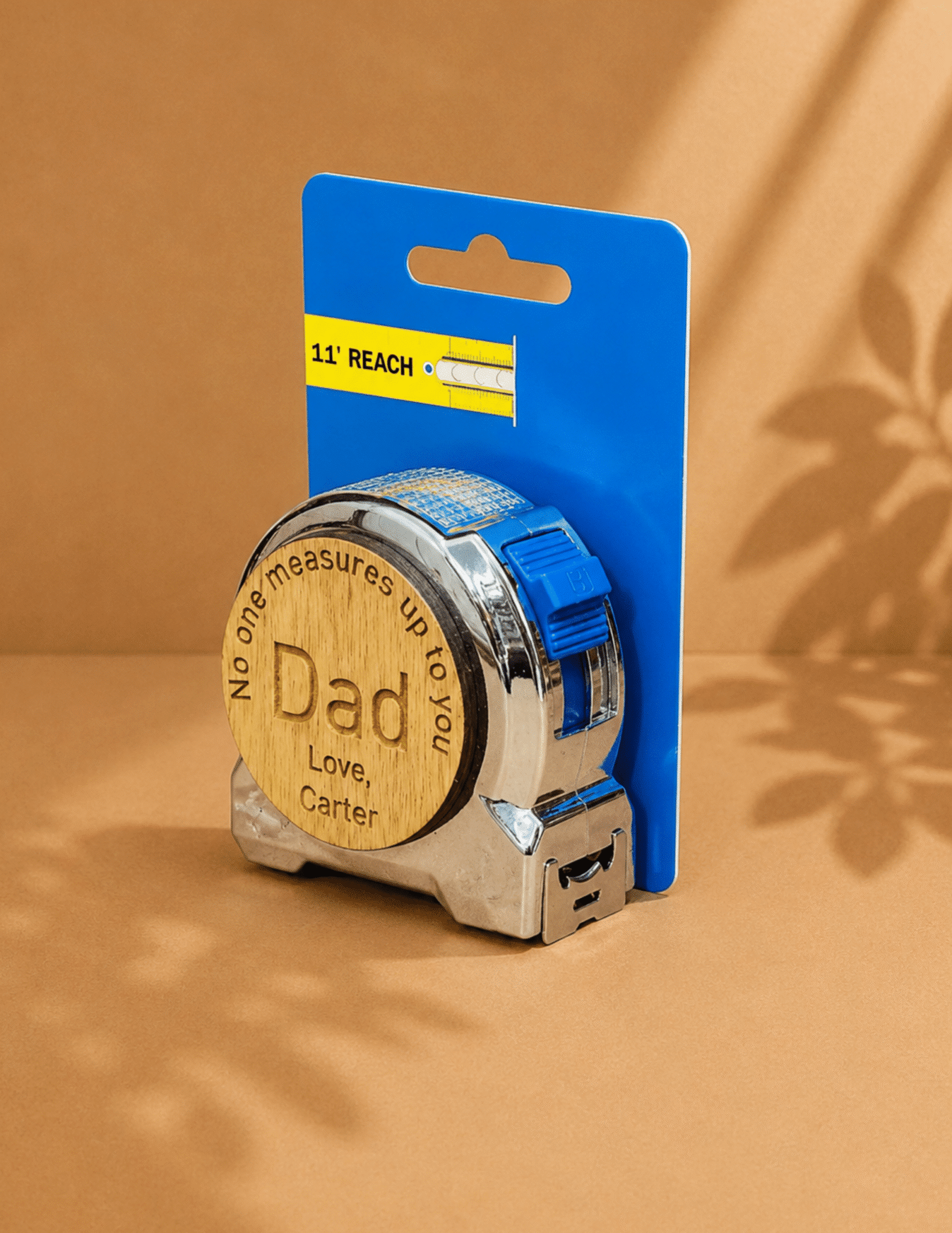 Personalized engraved measuring tape with "No One Measures Up to You Dad" message and custom child’s name.