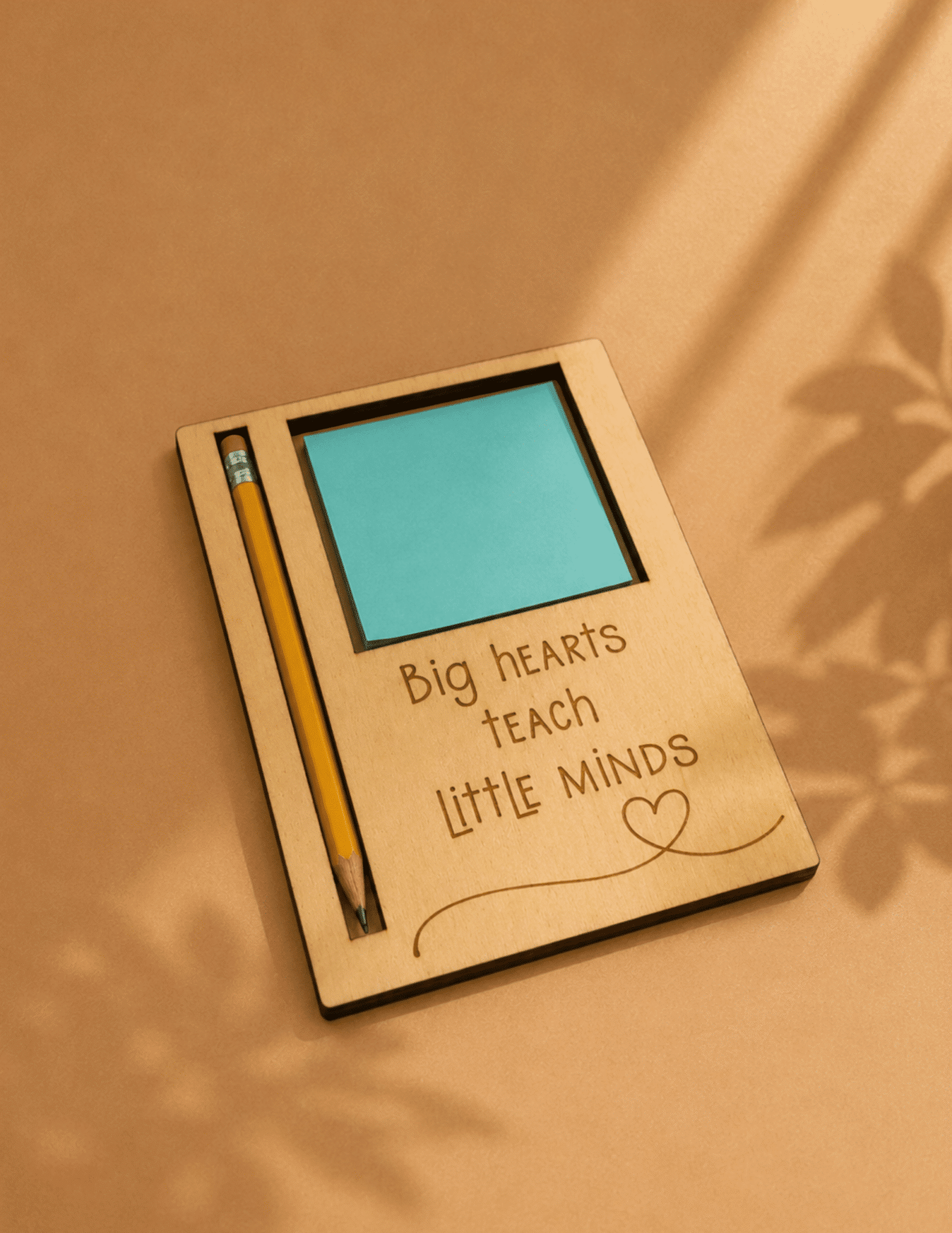 Wooden teacher Post-it note and pencil holder with engraved quote and sticky note pad for classroom desk.