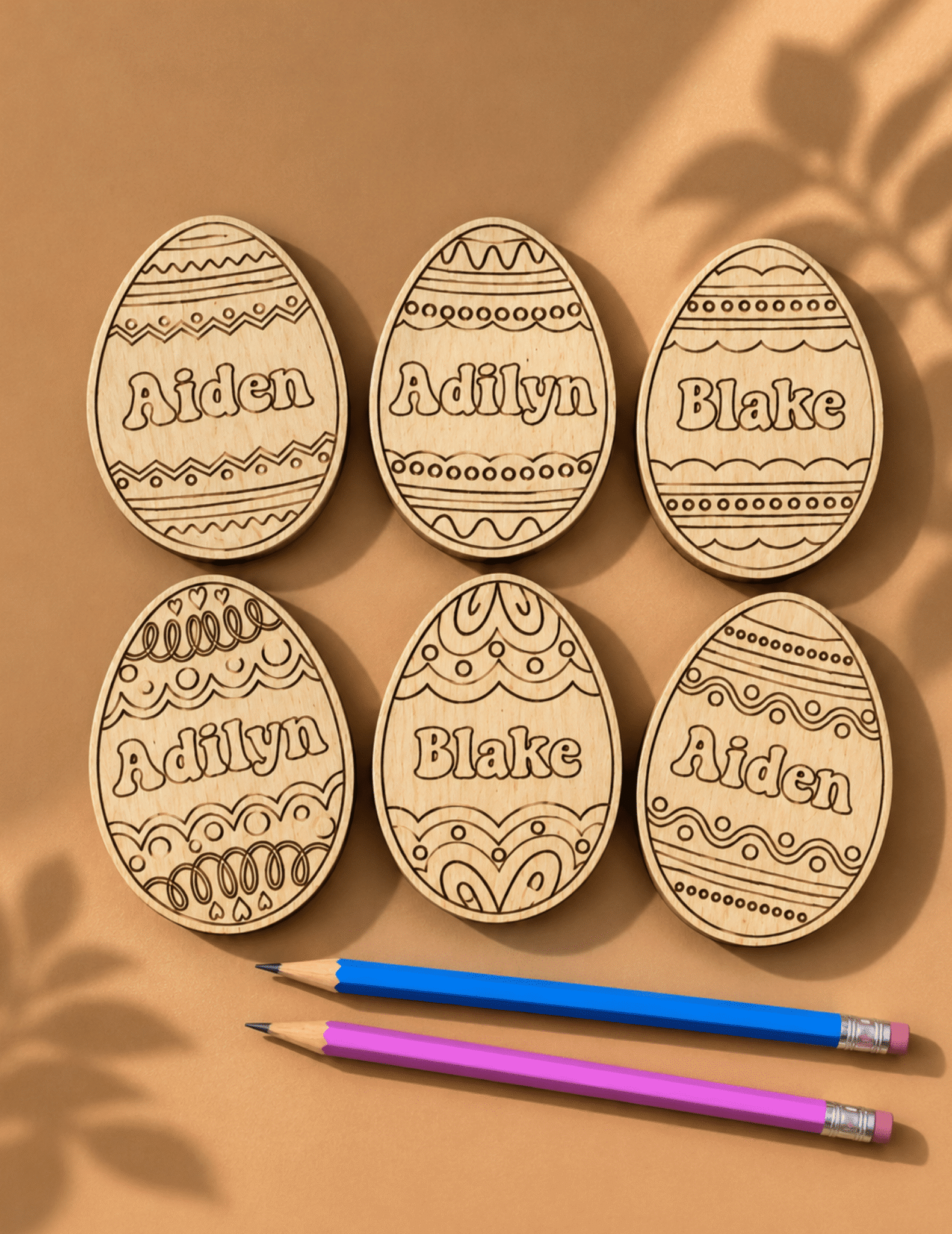 Personalized Easter Coloring Eggs with engraved wooden egg designs, custom names, and ready-to-color Easter craft set.
