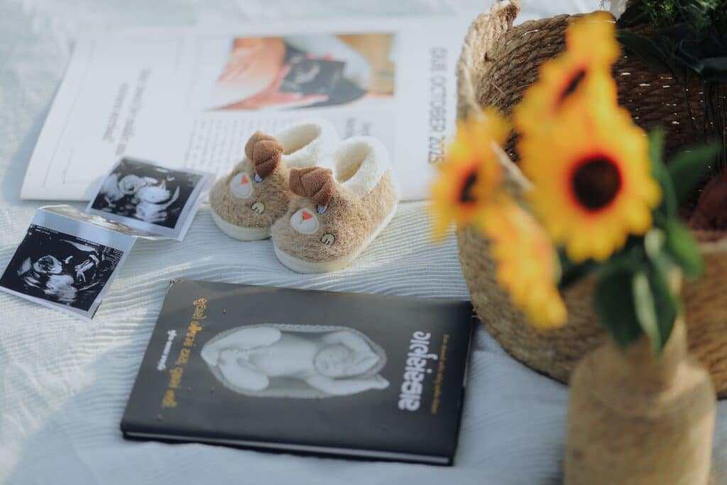 Baby keepsakes with ultrasound photos and baby shoes