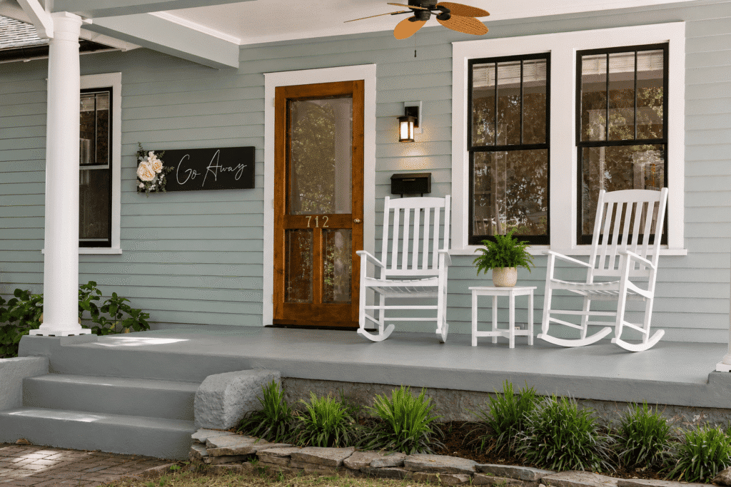 Custom wood wall decor on a welcoming front porch